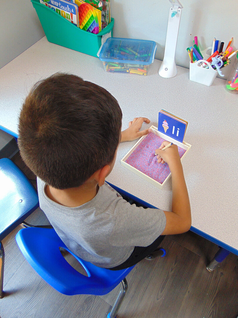 Kid doing Autism testing at table